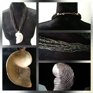 Black multi strand beaded necklace